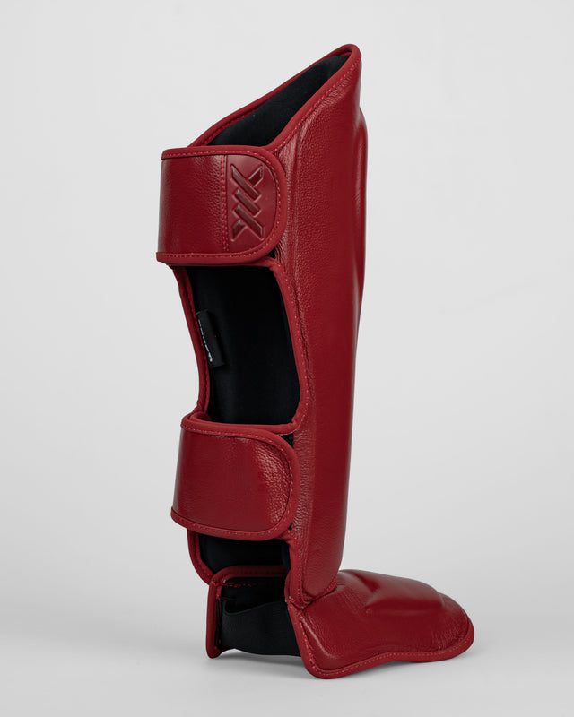 Espinilleras Caged 'X' Series - Rojo Burdeos