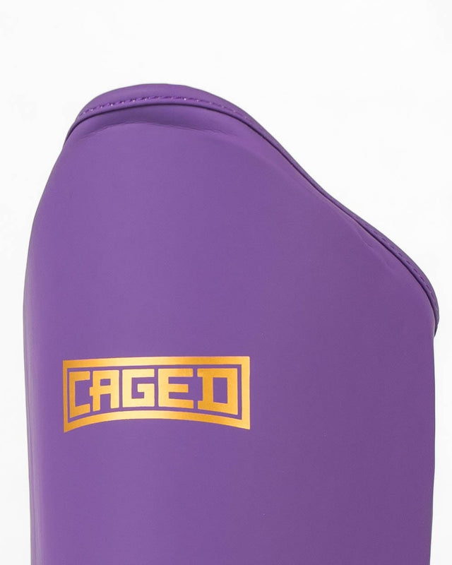 Caged Schienbeinschoner Shadow – Lila/Gold