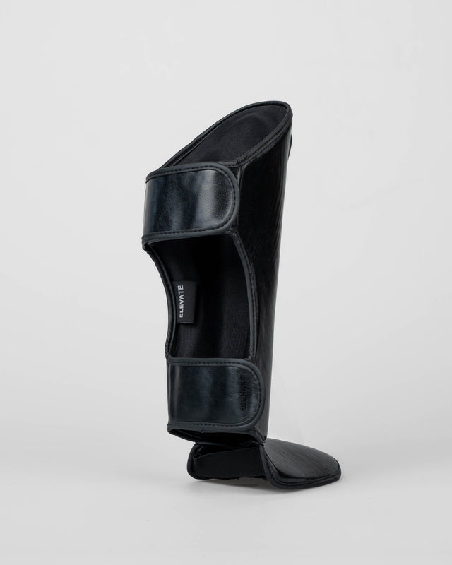 Espinilleras Elevate Prime Niños – Negro