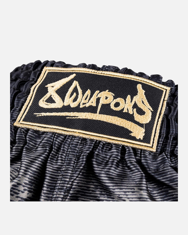 Pantaloncini Muay Thai 8 WEAPONS Hanuman – Nero/Oro