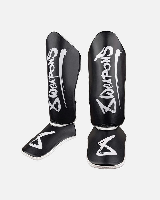 Espinilleras 8 WEAPONS Unlimited 2.0 – Negro/Blanco