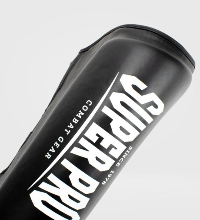 Tibiere Super Pro Kickboks Protector – Negru/Alb – Tibiere