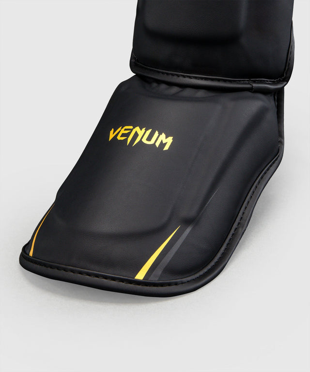 Protège-tibias Venum G-Core – Noir/Or