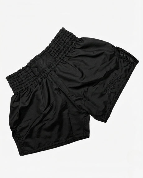 Caged Muay Thai shorts Classic - Sort/Sort flat lay