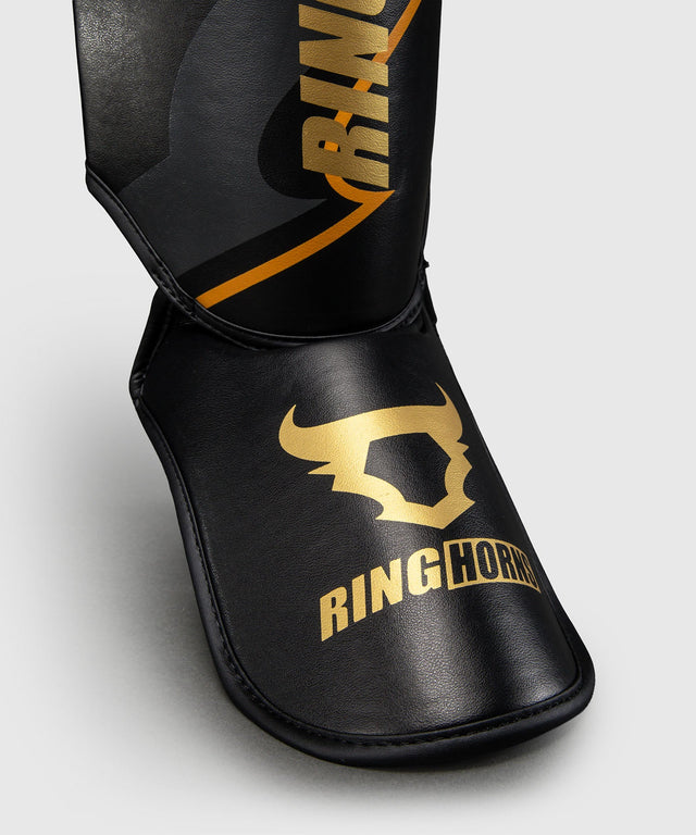 Espinilleras Ringhorns Charger – Negro/Oro