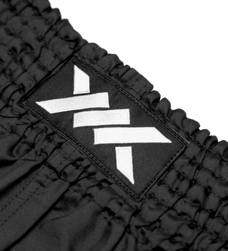 Pantalones de Muay Thai Caged Classic – Negro/Blanco mujer