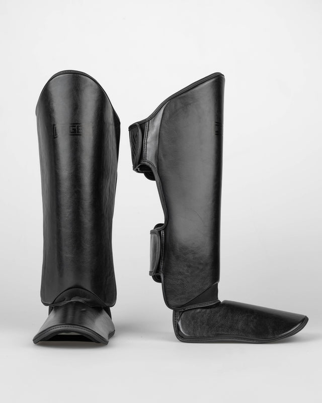 Espinilleras Caged Shadow – Negro/Negro