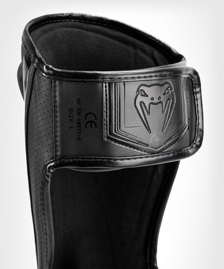 Protège-tibias Venum Elite Evo – Noir/Noir