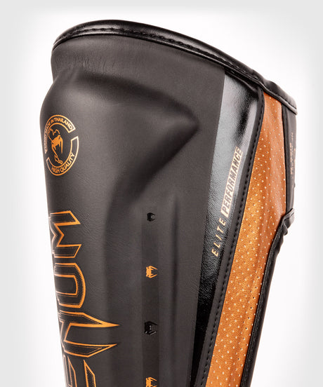 Protège-tibias Venum Elite Evo – Noir/Bronze