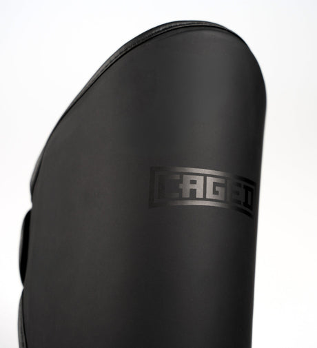 Espinilleras Caged Kickboks Shadow – Negro/Negro
