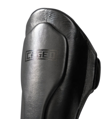 Espinilleras Caged Kickboks 'X' Series – Negro/Negro