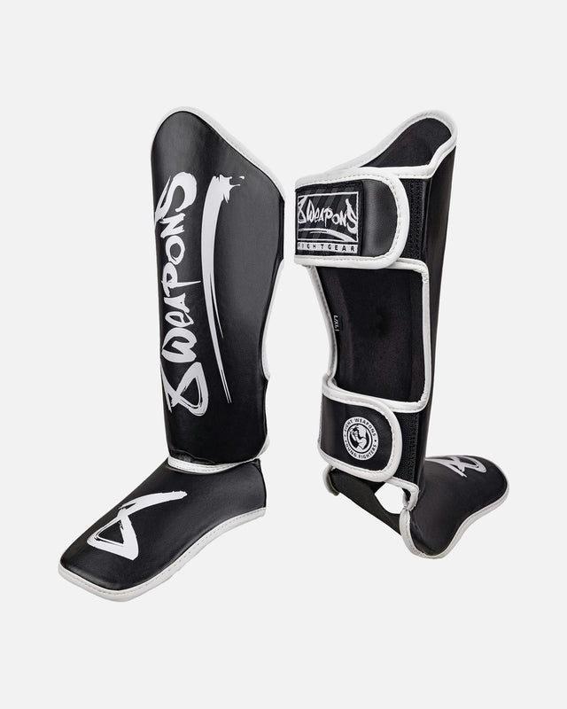 Espinilleras 8 WEAPONS Unlimited 2.0 – Negro/Blanco