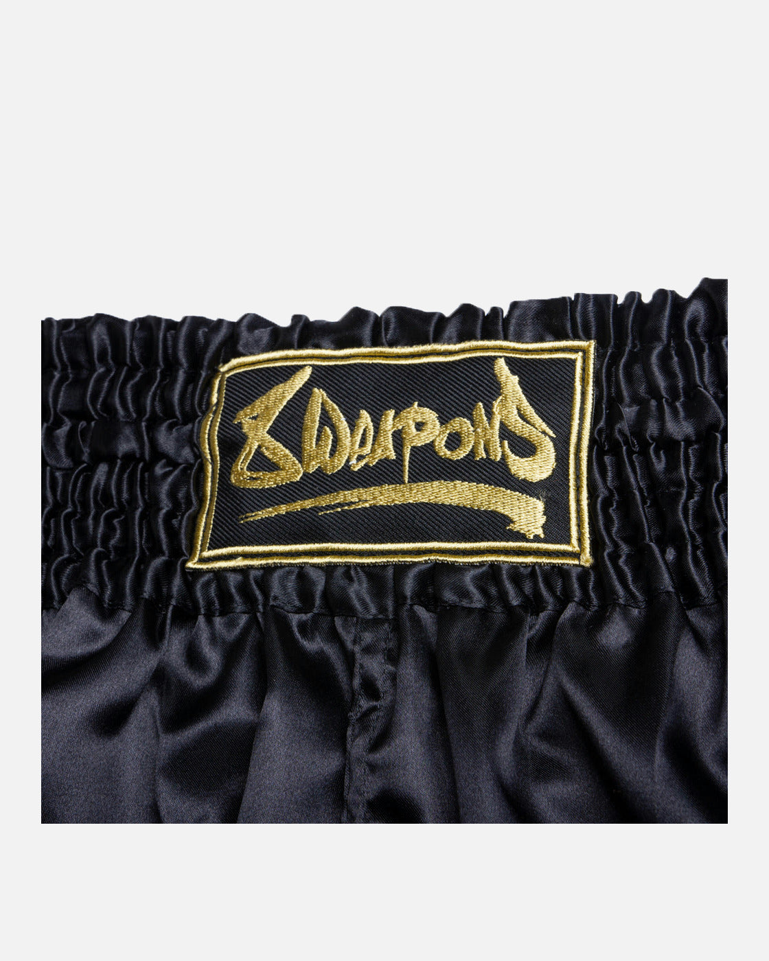 8 WEAPONS Muay Thai Shorts Strike – Black/Gold