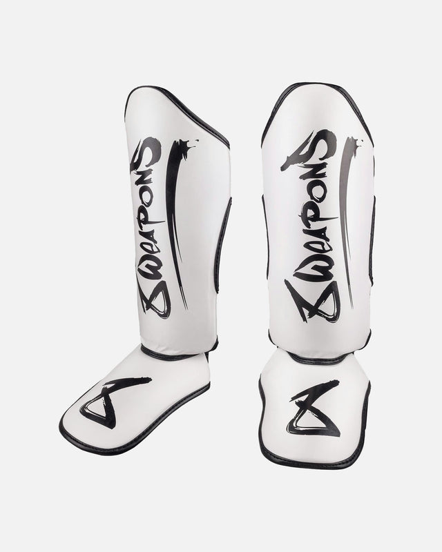 Espinilleras 8 WEAPONS Unlimited 2.0 – Blanco/Negro