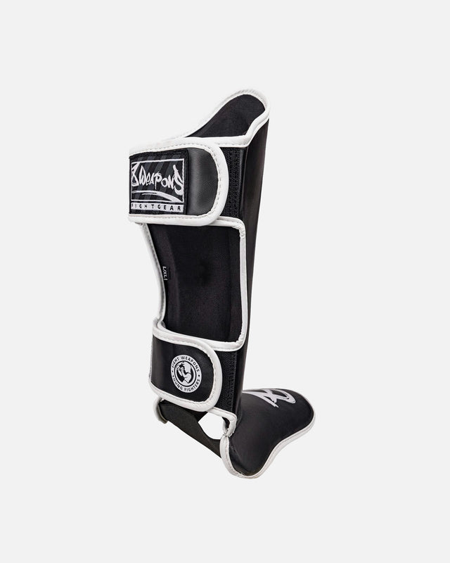 Espinilleras 8 WEAPONS Unlimited 2.0 – Negro/Blanco