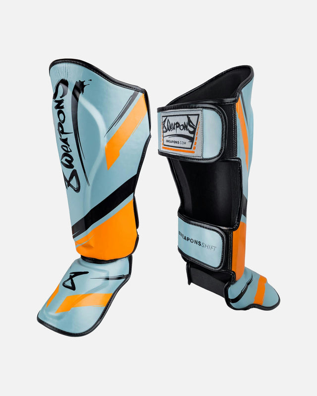 Espinilleras 8 WEAPONS Shift – Gris hielo/Naranja
