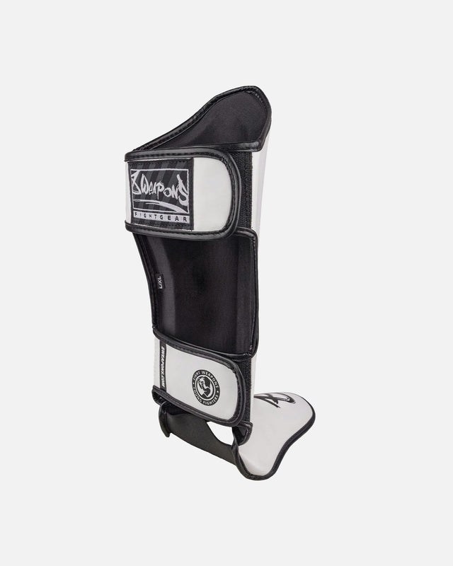 Espinilleras 8 WEAPONS Unlimited 2.0 – Blanco/Negro
