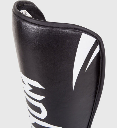 Espinilleras Venum Challenger – Negro/Blanco