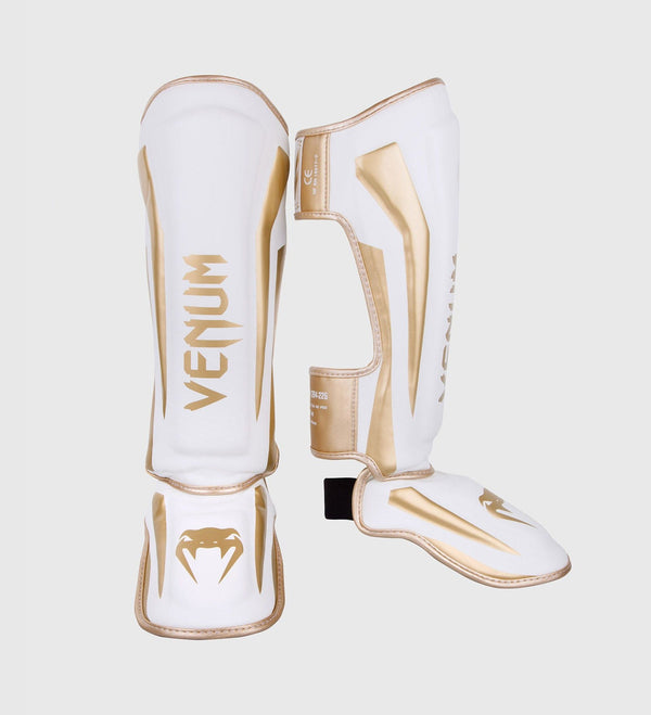 Caneleiras de kickboxing Venum Elite – Branco/Ouro